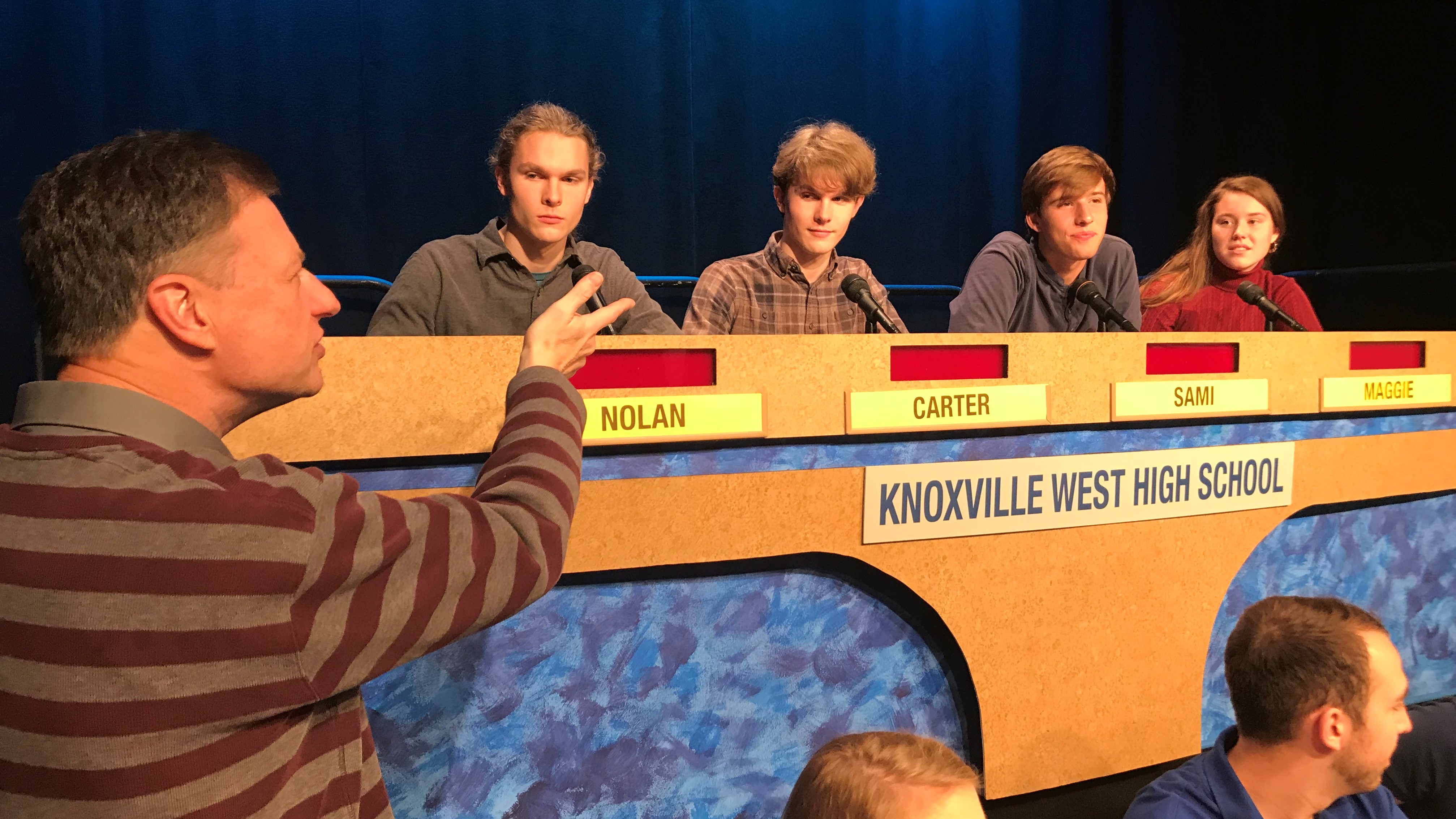 West High School students listen as Scholars Bowl executive producer Ernie Roberts gives instructions before a taping of the show. 